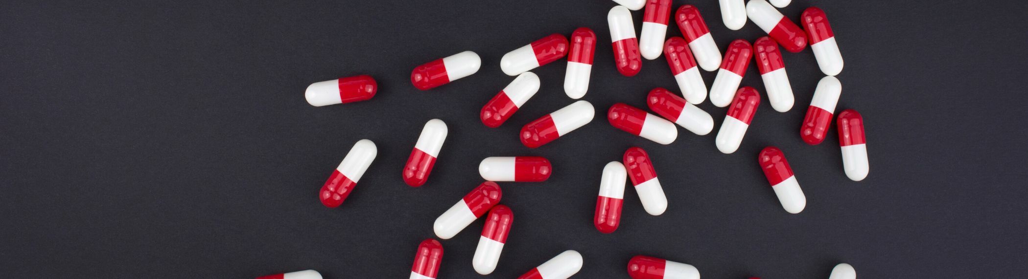 red and white capsule pills